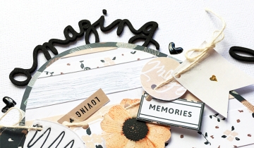 Using pre-made embellishments in scrapbook layouts